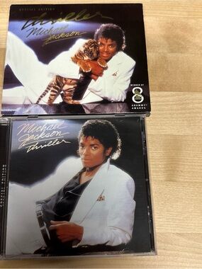 Source Unknown White Jacket Thriller CD with Black and Gold Accents